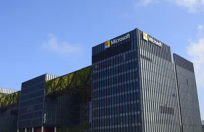 Exterior view of a Microsoft data center. Black multistory industrial building with Microsoft logo.