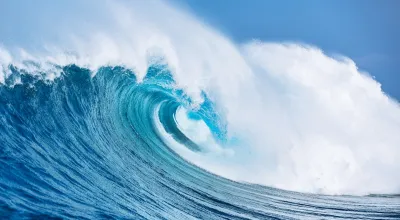 Large ocean wave cresting.