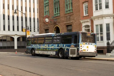 White and blue NJ Transit bus in Trenton, New Jersey.