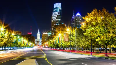 Night view of Ben Franklin Parkway in Philadelphia, Pennsylvania looking toward Philadelphia City Hall.