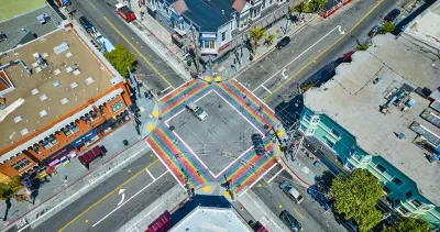 Aerial view of rainbow painted four-way crosswalk in the Castro district, San Francisco, California.