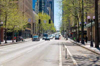Street view of 4th Avenue, a commercial street of shops and restaurants through the city center of downtown Seattle, Washington.