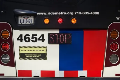 Close-up on rear of Houston Metro bus with license plate and bus number.
