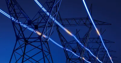 Power powers at night with 'glowing' power lines emphasizes with graphics.