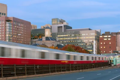 Blurred Red Line train in Boston passing on elevated rail.