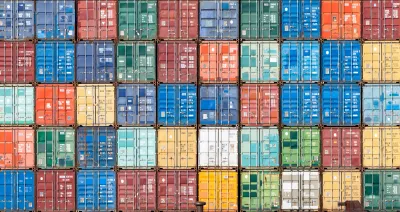 Multilevel stack of colorful shipping containers