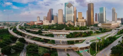 View of downtown Houston with elevated freeways in foreground.