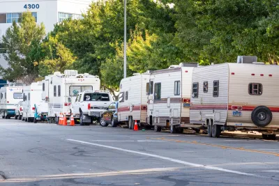 Row of RVs parked on street in Mountain View, California.