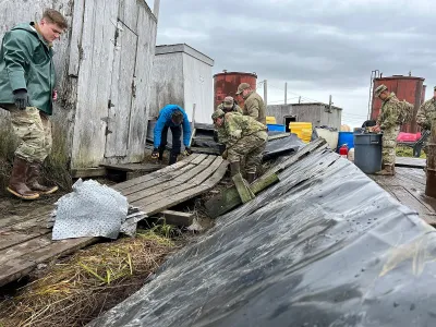 National Guard troops clearing storm debris in Newtok, Alaska