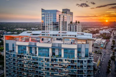The top floors of a luxury condo building is seen at sunset in Downtown Austin.