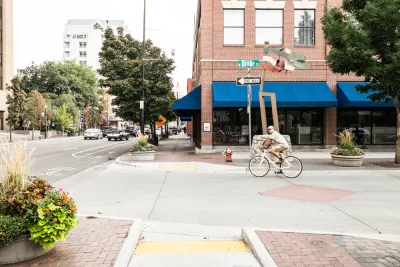 A man on a bike prepares to turn off a one way street onto a bike lane in Downtown Boise, Idaho.