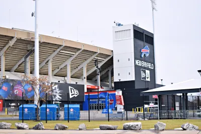 A football stadium, the home of the Buffalo Bills NFL team, is shown from the outside on a gloomy winter day.