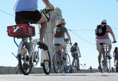 People on bikes riding across 4th Street Bridge in Los Angeles during 2010 CicLAvia event.