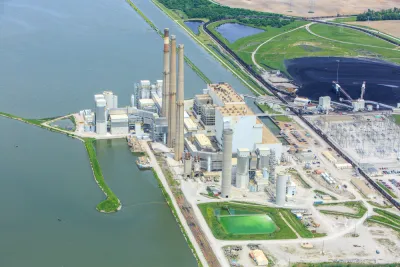 An image of a coal powered energy production facility along an unidentified waterway in Illinois.