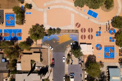 Bird's eye wide view of schoolyard with coated pavement.