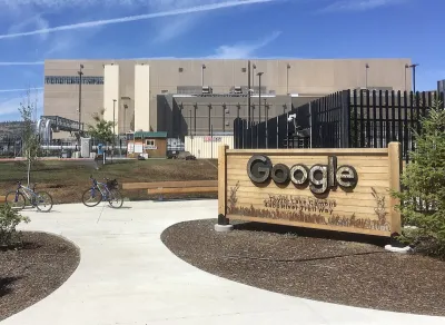 Data center with Google sign in front of black fence in The Dalles, Oregon.