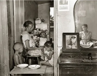 Mrs. Ella Watson, a government charwoman, with three grandchildren and her adopted daughter