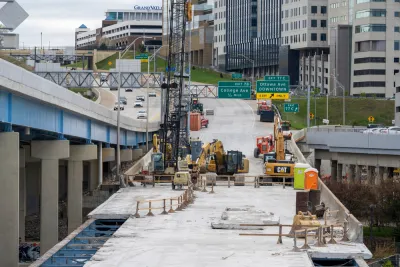 Construction work to replace the bridge deck carrying eastbound I-196 over Grand River in downtown Grand Rapids.