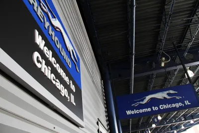 Close-up of Welcome to Chicago sign with Greyhound bus company logo in downtown Chicago, Illinois bus terminal.