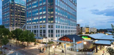 Rendering of TOD with two glass towers abovw MARTA transit station in Kensington near Atlanta, Georgia.