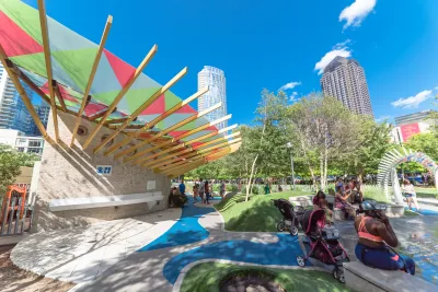 A children's play area is busy with kids and their parents in Downtown Dallas.