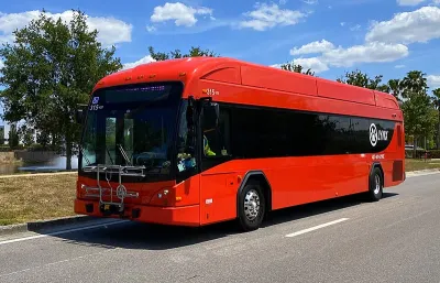 Red Lynx bus in operation on Vineland Avenue in Orlando, Florida in April 2021.