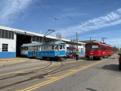 A pair of vintage Siemens–Duewag U2 trolleys roll out of a garage in Memphis.