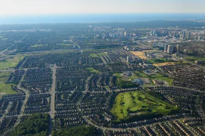 An aerial view of Mississauga, Ontario, with Lake Ontario in the background.