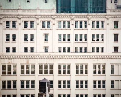 A closeup of rows of buildings lined by old fashioned windows in New York City.