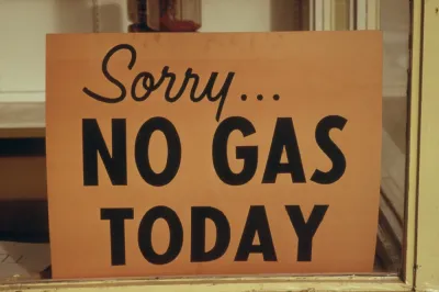 A sign reads “Sorry No Gas Today”.