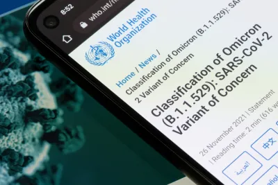 An image showing a smart phone with information from the World Health Organization about the Omicron variant of the coronavirus.