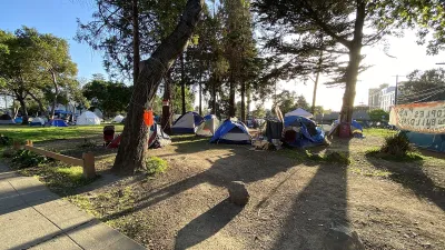 This is a panoramic photograph taken on April 1st, 2021, of People's Park in Berkeley, California. During the COVID-19 pandemic the authorities eased restrictions on overnight camping by homeless persons on the grounds of People's Park. The photograph shows the presence of some of the tents set up during this period.