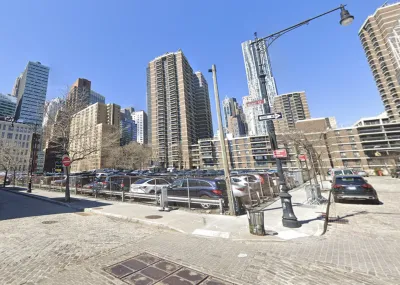 Google Street view of 250 Water Street parking lot with tall buildings in background