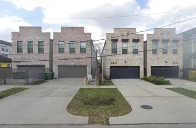 Two-story split lot housing in Houston, Texas with two-car garages