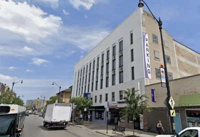 Google street view of white parking garage building in Chicago in 2018 prior to conversion to apartments
