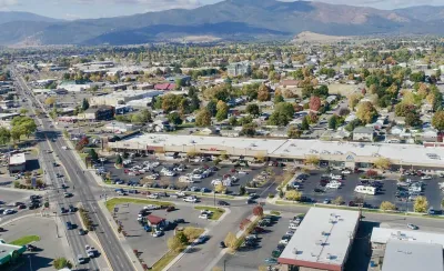 Aerial view of midtown Missoula, Montana with mountains in background