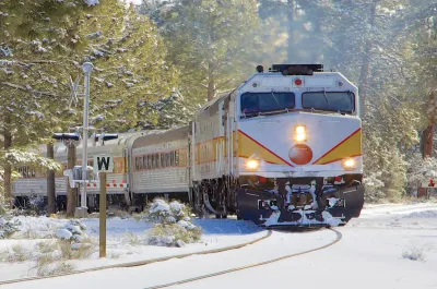 Train passing through a snowy landscape.
