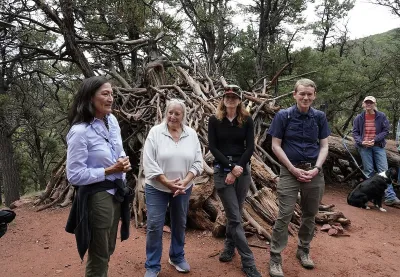 Interior Secretary Deb Haaland standing in a forested area in Colorado to celebrate recent action by the Biden-Harris administration to withdraw around 220,000 acres in the Thompson Divide area for mineral leasing on 1 July 2024.