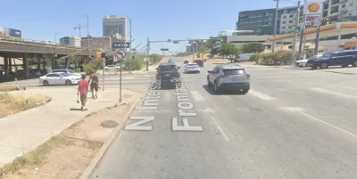 A concrete expanse is visible at the intersections of two wide roads in Austin, Texas.