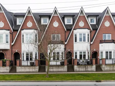Row of brick three-story townhomes in Britih Columbia.
