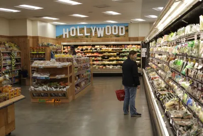 A woman in a mask shops at Trader Joe's.