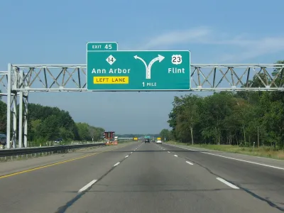 Green highway signs on Highway 23 for Ann Arbor and Flint, Michigan.