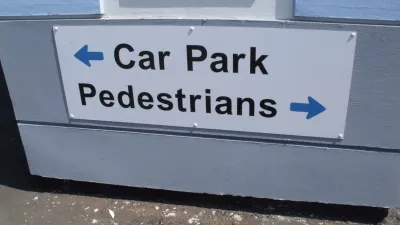A sign for pedestrians and cars