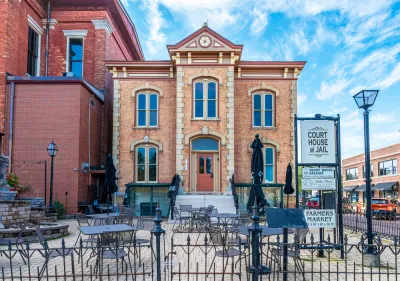 A street view showing the historic courthouse and jail in Woodstock, Illinois.