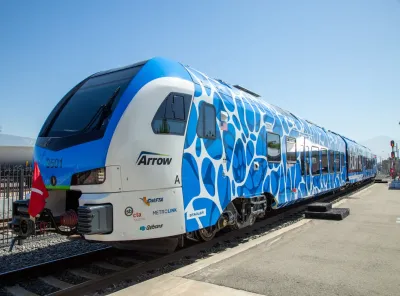 Blue and white Zero-Emission Multiple Unit (ZEMU) hydrogen-powered train in San Bernardino, California.