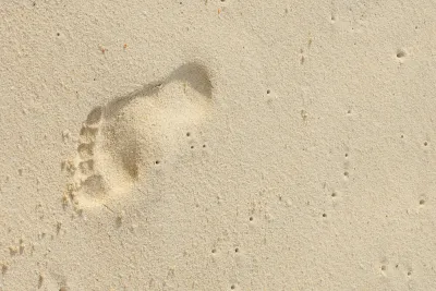 Footprint on sand at beach