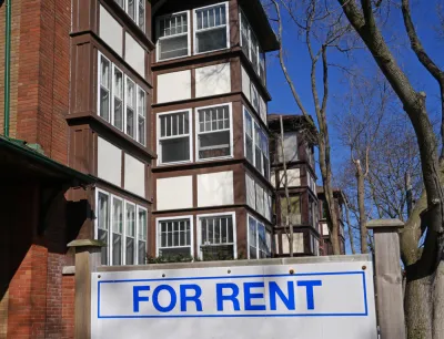 Brick apartment building with For Rent sign