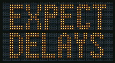 Yellow on black "Expect Delays" traffic sign