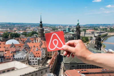 Airbnb logo over Dresden
