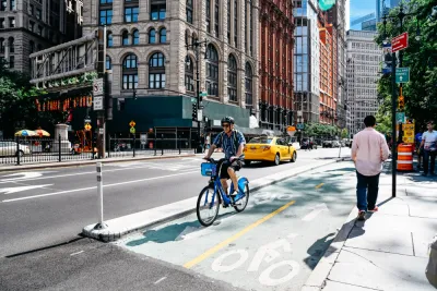 A rider on a Citibike on a bike lane in New York City
